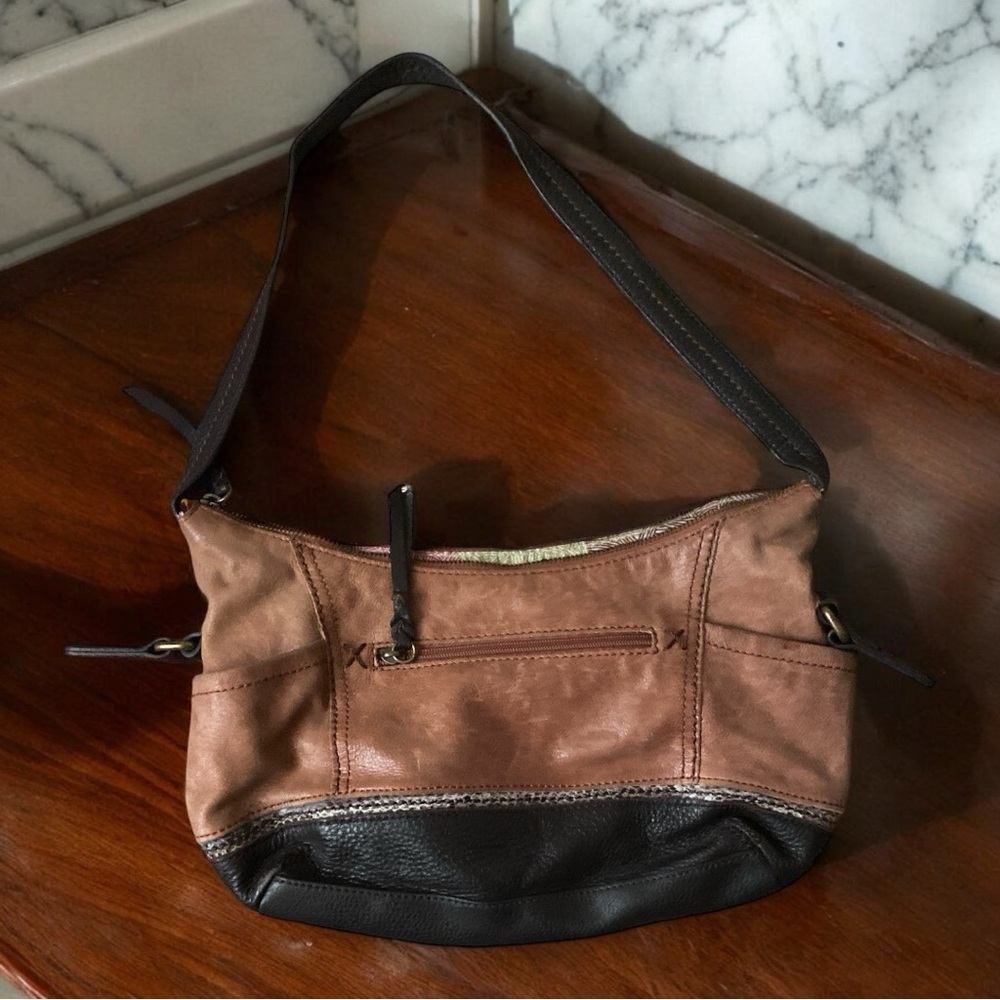 Nice brown bag from the Sak. The leather is a tad bit  faded.